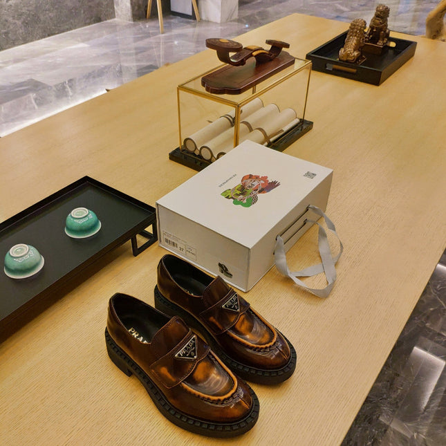 PRADA 26S PENNY LOAFERS 55MM IN BROWN PATENT CALFSKIN