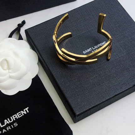 YSL 26S CRISS CROSS OPEN CUFF BRACELET IN GOLD TONE METAL 635064