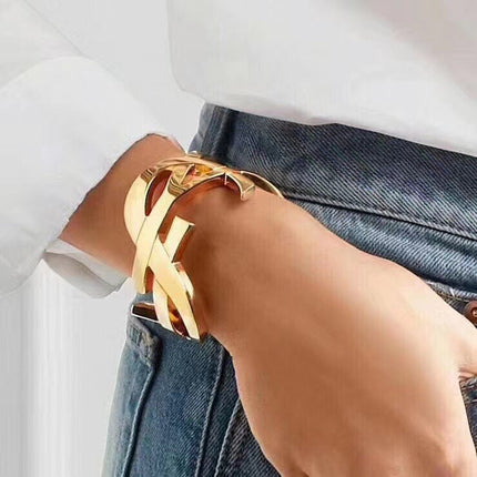 YSL 26S CRISS CROSS OPEN CUFF BRACELET IN GOLD TONE METAL 635064