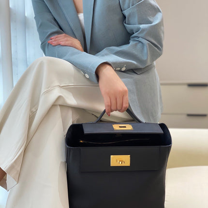 MINI 24/24 29CM IN BLACK EVERCOLOR CALFSKIN GOLD KELLY BUCKLE