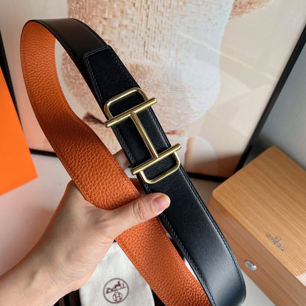 HM ROYAL BELT BUCKLE & REVERSIBLE NOIR AND ORANGE LEATHER STRAP 32 MM GOLD HARDWARE