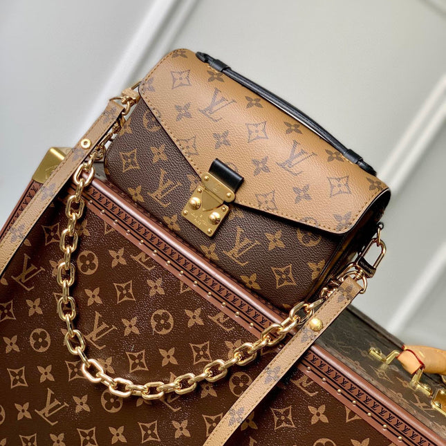 POCHETTE MÉTIS EAST WEST 21.5 IN BROWN MONOGRAM COATED CANVAS AND CALFSKIN