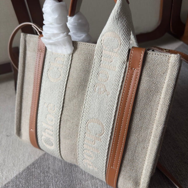 SMALL WOODY TOTE BAG 26.5 IN BEIGE LINEN CANVAS WEBBING LOGO EMBROIDERY BROWN CALFSKIN