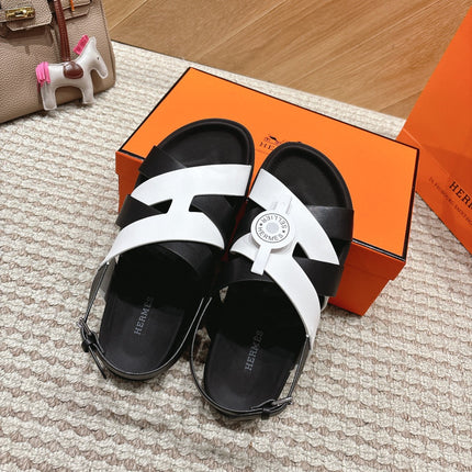 HM 26S CROSS-STRAP SANDALS IN BLACK AND WHITE CALFSKIN