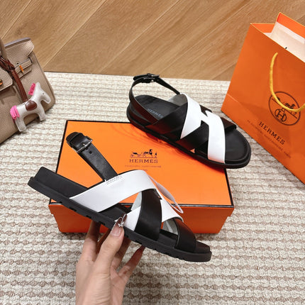 HM 26S CROSS-STRAP SANDALS IN BLACK AND WHITE CALFSKIN