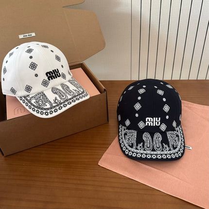 MIUMIU BASEBALL CAP IN BLACK WITH WHITE EMBROIDERED PATTERN