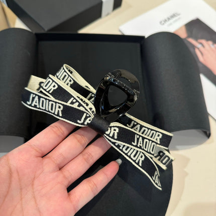 DIOR 26S BOW HAIR CLIP IN BLACK ACETATA 500564