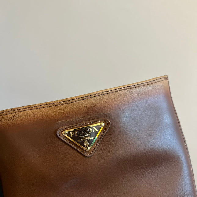 PRADA 25S HIGH-CUT PLATFORM BOOTS IN BROWN CALFSKIN WITH GOLD HARDWARE