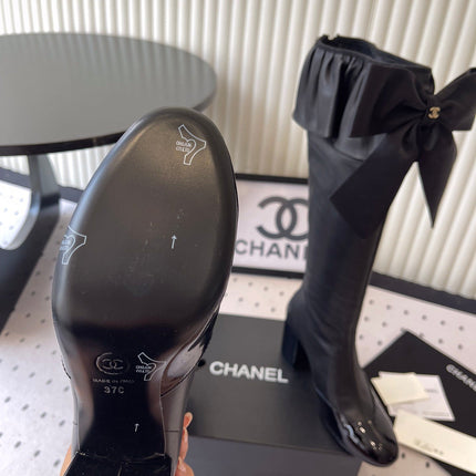 CHANEL BOW HIGH BOOTS IN BLACK CALFSKIN