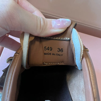 MIUMIU 26S GYMNASIUM SNEAKER IN COGNAC BROWN CALFSKIN WITH GOLD BUCKLED STRAP