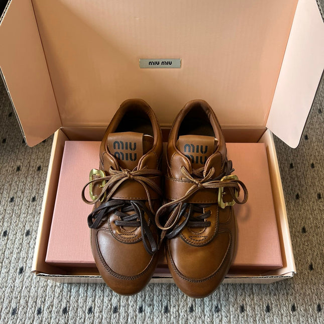 MIUMIU 26S GYMNASIUM SNEAKER IN COGNAC BROWN CALFSKIN WITH GOLD BUCKLED STRAP