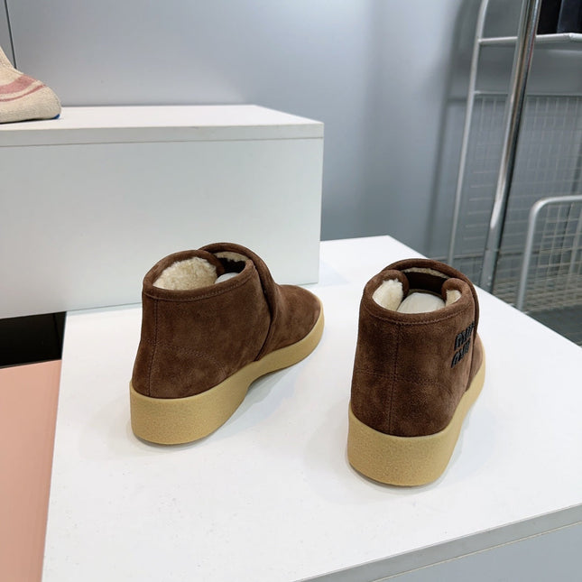 MIUMIU 25S SLIP-ON BOOTIES IN DARK BROWN SUEDE AND SHEARLING