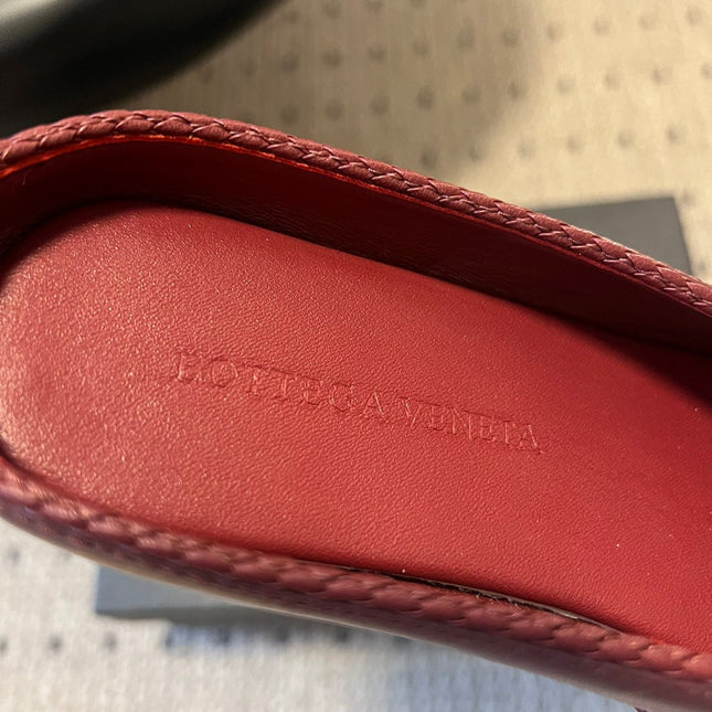 BOTTEGA VENETA 26S FLAT MULES IN DARK RED LAMBSKIN
