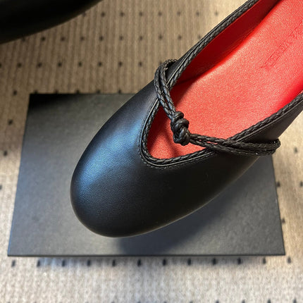 BOTTEGA VENETA 26S FLAT MULES IN BLACK LAMBSKIN