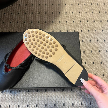 BOTTEGA VENETA 26S FLAT MULES IN BLACK LAMBSKIN