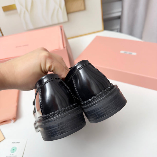 MIUMIU 26S TASSEL LOAFERS IN BLACK CALFSKIN