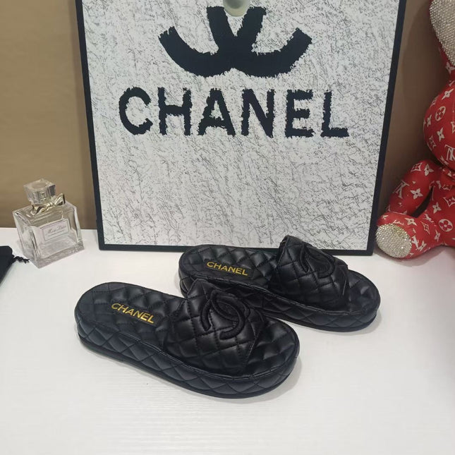 CHANEL 26S QUILTED SLIDE SANDALS IN BLACK CALFSKIN