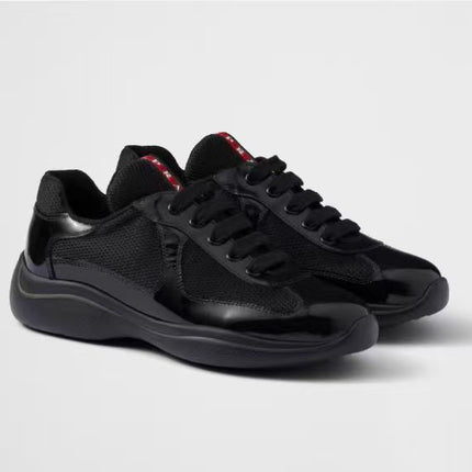 PRADA SNEAKER 25S IN BLACK MESH AND PATENT CALFSKIN