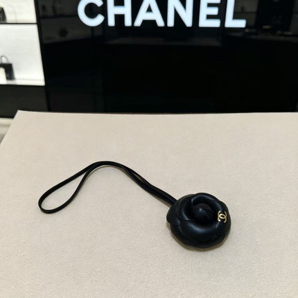 CHANEL CAMELLIA BAG CHARM IN BLACK LAMBSKIN