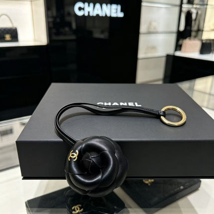 CHANEL CAMELLIA BAG CHARM IN BLACK LAMBSKIN