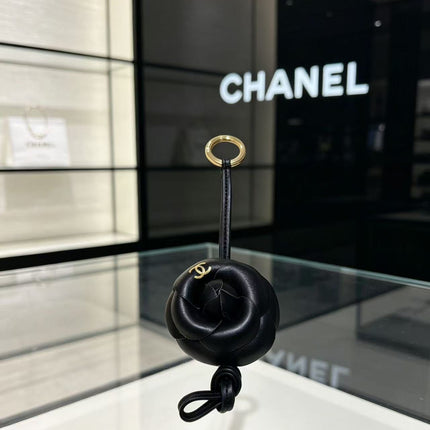 CHANEL CAMELLIA BAG CHARM IN BLACK LAMBSKIN