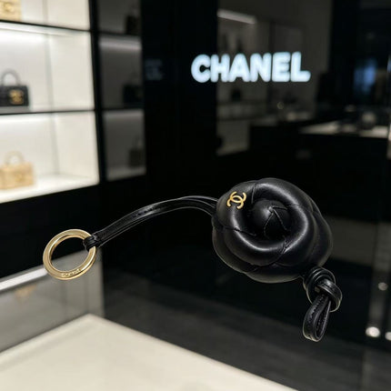 CHANEL CAMELLIA BAG CHARM IN BLACK LAMBSKIN