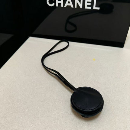 CHANEL CAMELLIA BAG CHARM IN BLACK LAMBSKIN