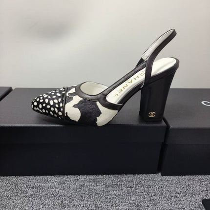 CHANEL SLINGBACK HEELS IN BLACK AND WHITE COW PRINT