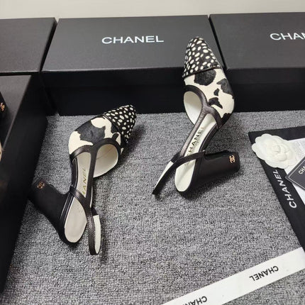 CHANEL SLINGBACK HEELS IN BLACK AND WHITE COW PRINT