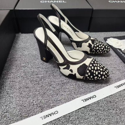 CHANEL SLINGBACK HEELS IN BLACK AND WHITE COW PRINT