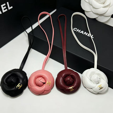 CHANEL CAMELLIA BAG CHARM IN BLACK LAMBSKIN
