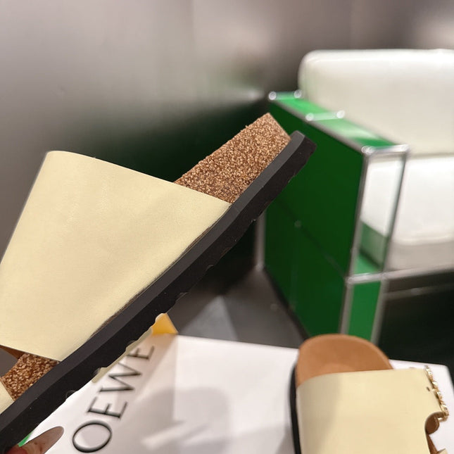 LOEWE 26S ANAGRAM FLAT SLIDES IN BEIGE CALFSKIN