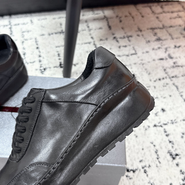 PRADA 26S SNEAKERS IN BLACK SHINY CALFSKIN