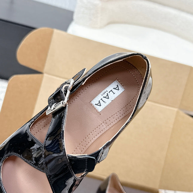 ALAIA 26S CROSS-STRAP BALLET FLATS IN BLACK GLOSSY LAMBSKIN