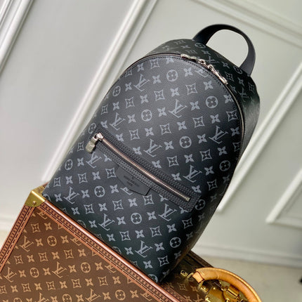DISCOVERY SLIM BACKPACK 38 IN BLACK MONOGRAM ECLIPSE COATED CALFSKIN