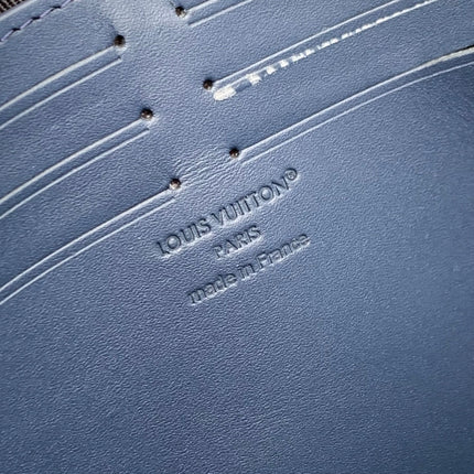 POCHETTE VOYAGE 27 IN DARK BLUE MONOGRAM ECLIPSE CALFSKIN EMBOSSED LOGO