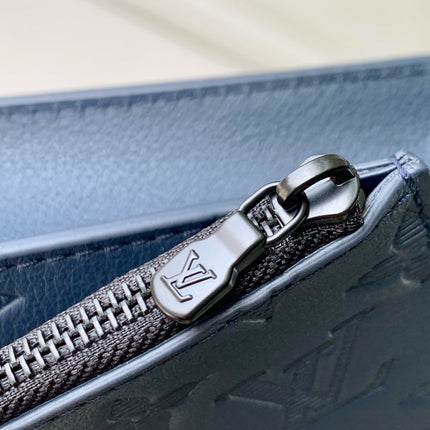 POCHETTE VOYAGE 22 IN DARK BLUE MONOGRAM SHADOW CALFSKIN