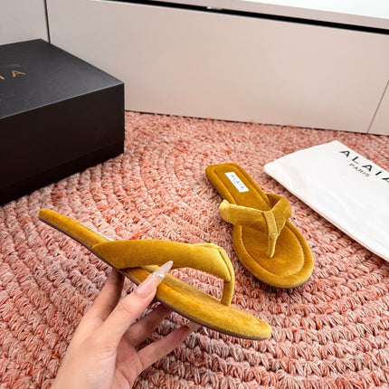 ALAIA 26S THONG SANDALS IN MUSTARD YELLOW VELVET