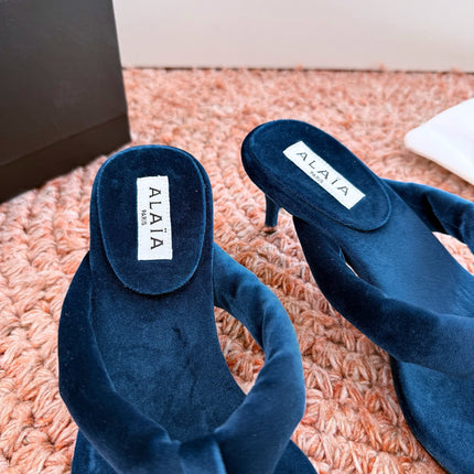ALAIA 26S HEELED THONG SANDALS IN DARK BLUE VELVET