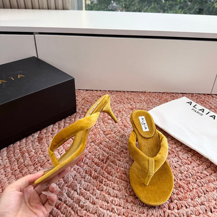 ALAIA 26S HEELED THONG SANDALS IN MUSTARD YELLOW VELVET