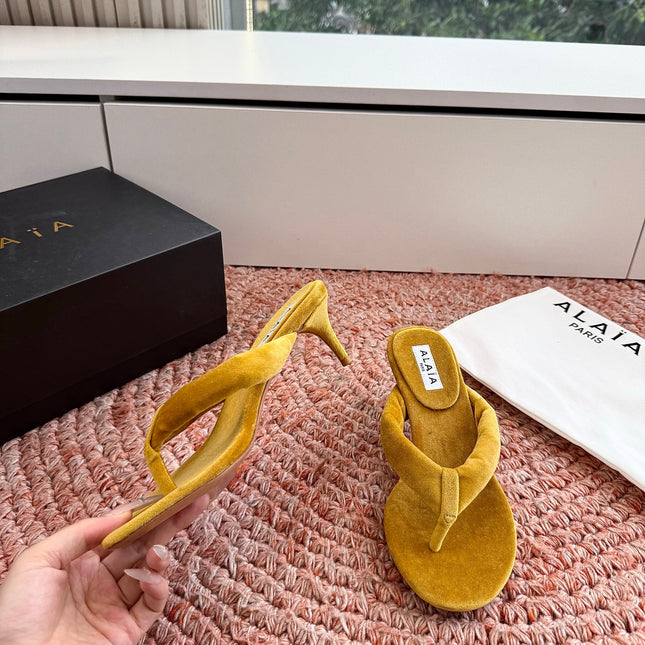 ALAIA 26S HEELED THONG SANDALS IN MUSTARD YELLOW VELVET