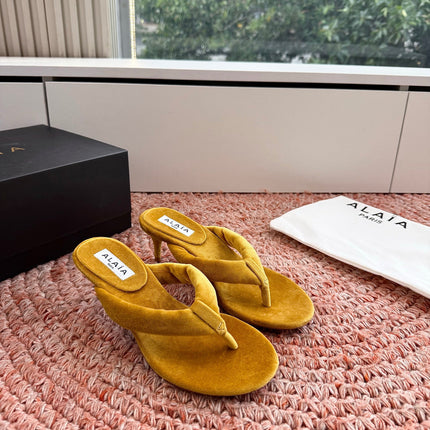 ALAIA 26S HEELED THONG SANDALS IN MUSTARD YELLOW VELVET