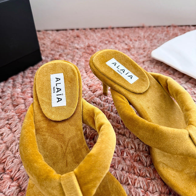 ALAIA 26S HEELED THONG SANDALS IN MUSTARD YELLOW VELVET