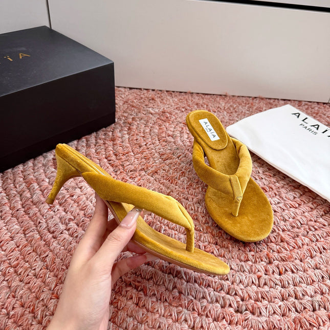ALAIA 26S HEELED THONG SANDALS IN MUSTARD YELLOW VELVET