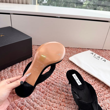 ALAIA 26S HEELED THONG SANDALS IN BLACK VELVET