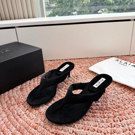 ALAIA 26S HEELED THONG SANDALS IN BLACK VELVET