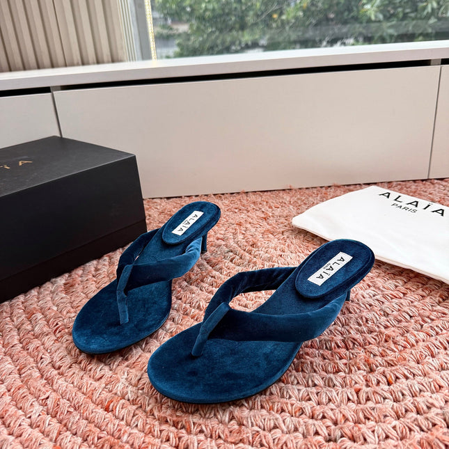 ALAIA 26S HEELED THONG SANDALS IN DARK BLUE VELVET