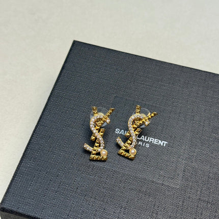 YSL 26S STUDDED CRYSTAL PEARL LOGO EARRINGS IN GOLD TONE METAL 629138