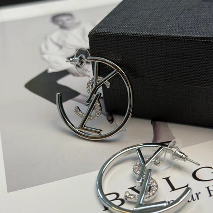 YSL 26S CRYSTAL LOGO HOOP EARRINGS IN SILVER TONE METAL 629137