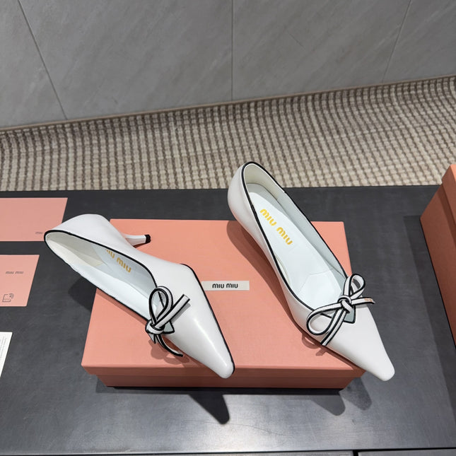 MIUMIU 26S POINTED TOE PUMPS 55MM IN WHITE AND BLACK CALFSKIN WITH BOW